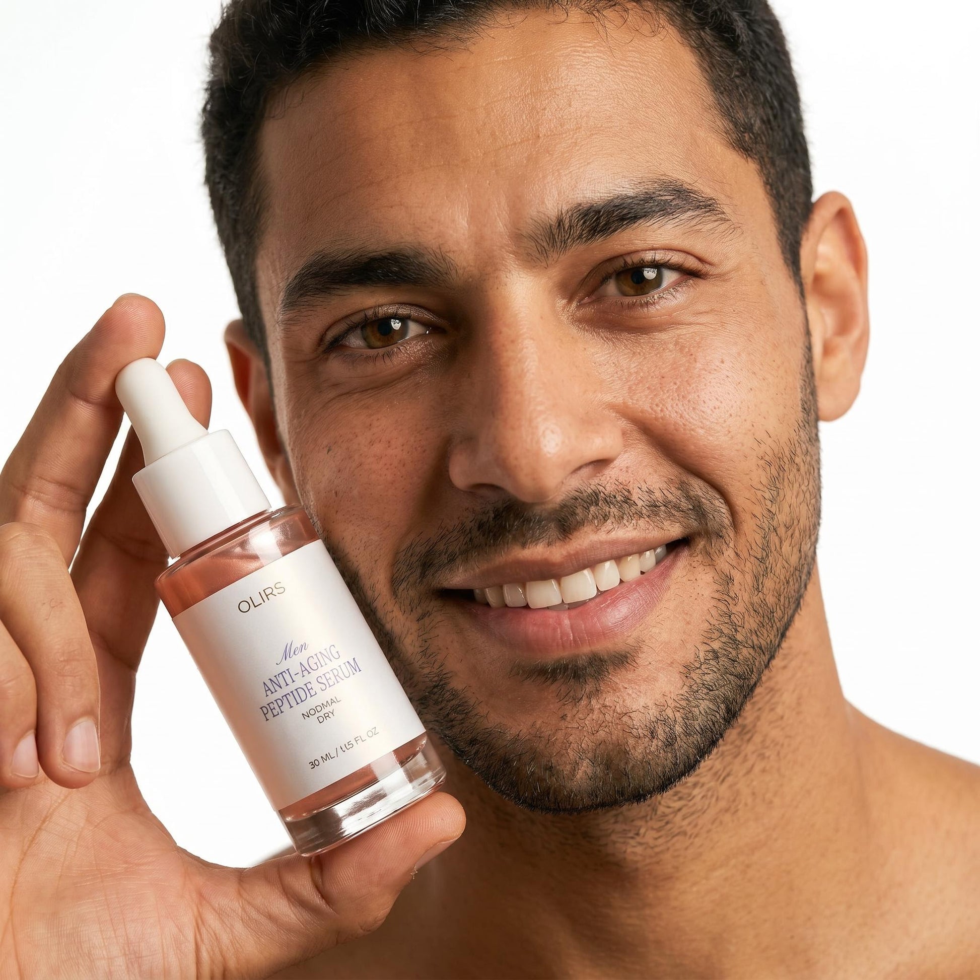 Visible Aging Defence Box - man holding peptide serum for smoother skin and hydration