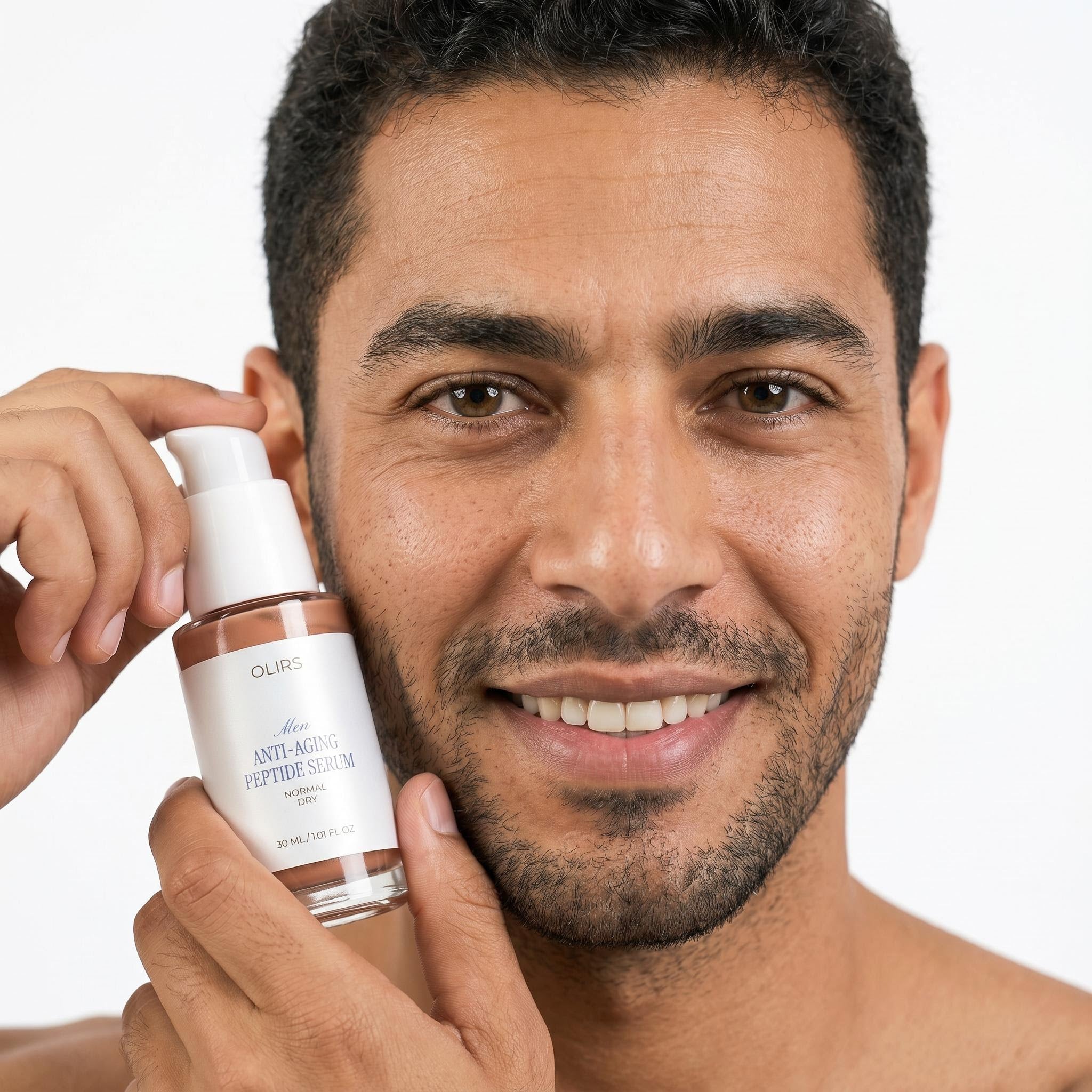 Man holding Peptide Firm-Look Serum, smiling and showcasing the product for skincare routine.