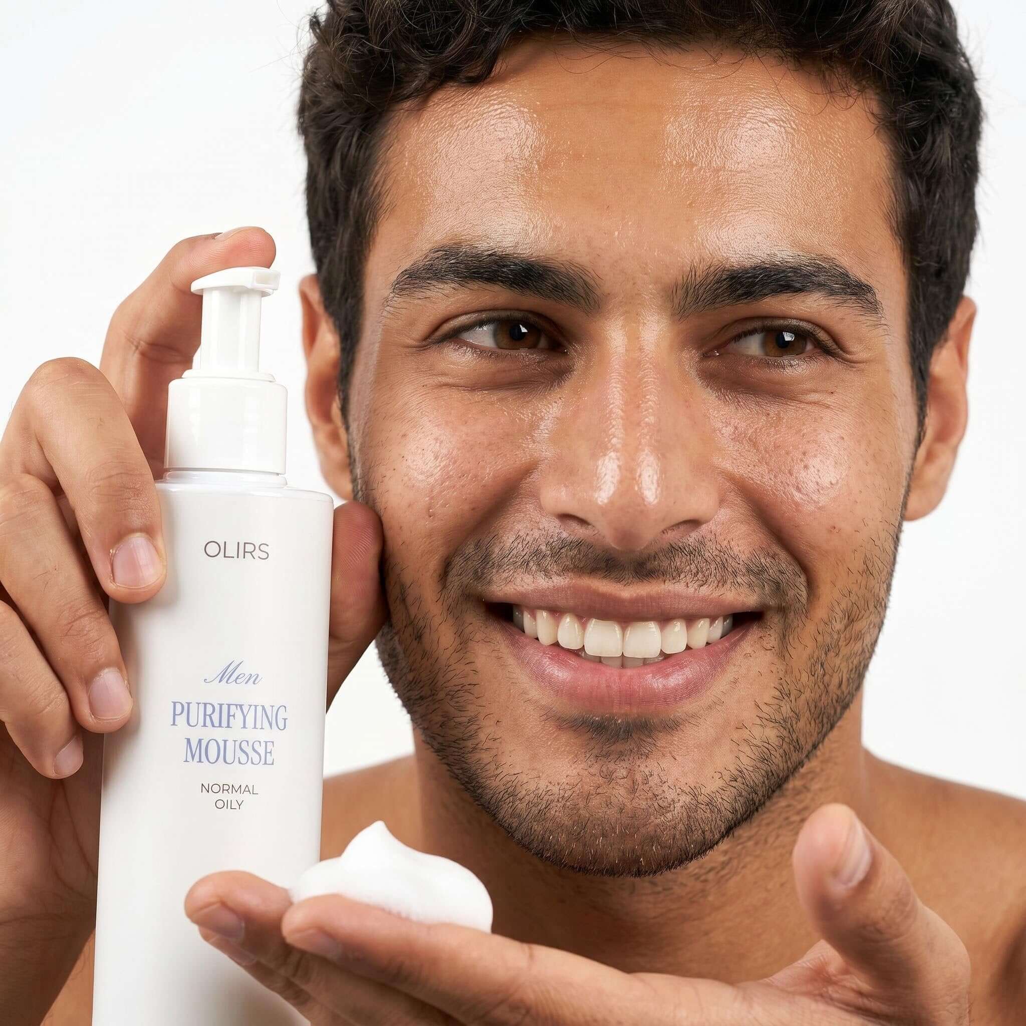 Man showcasing Daily Foaming Face Mousse with a soft lather for a fresh clean feel.