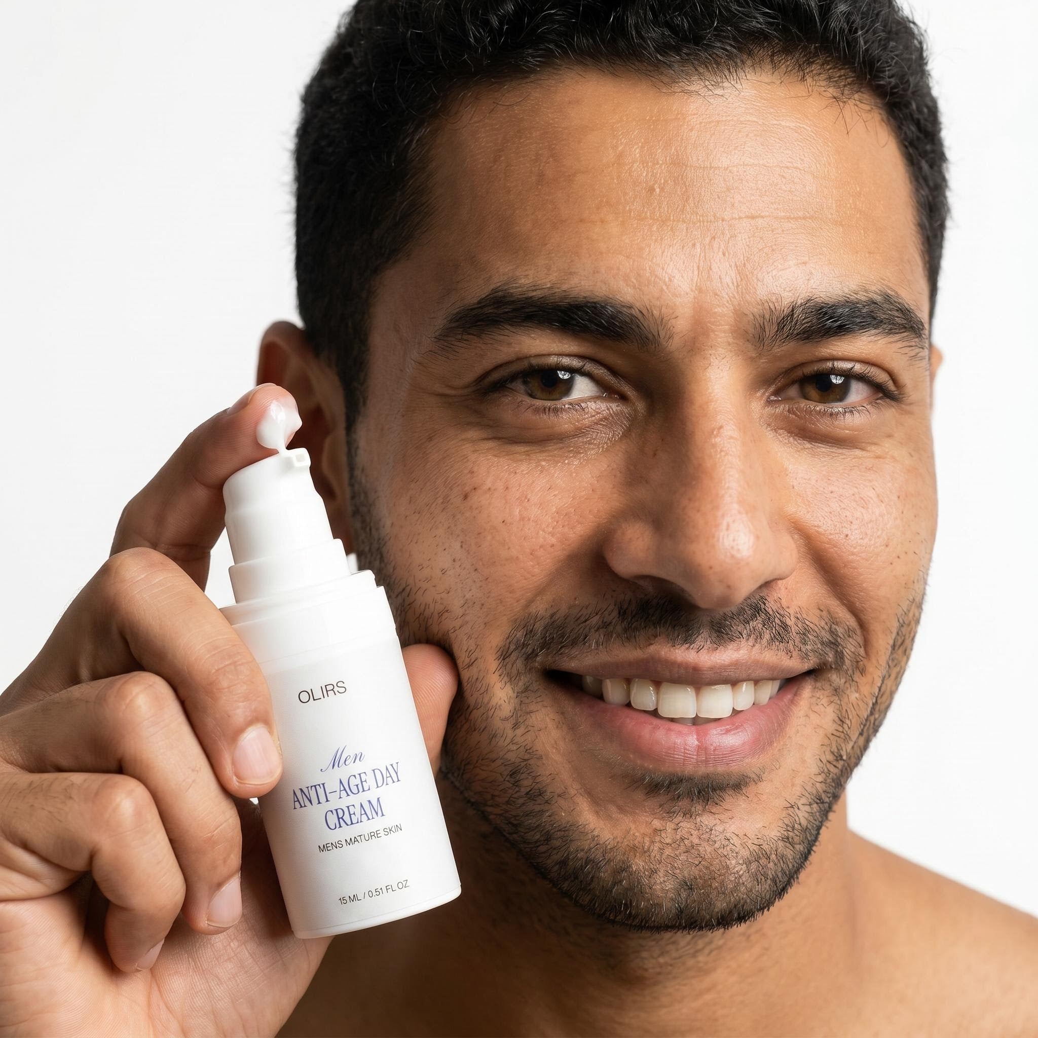 Man holding Men Anti-Age Day Cream, promoting skincare for mature skin in a 15ml bottle.