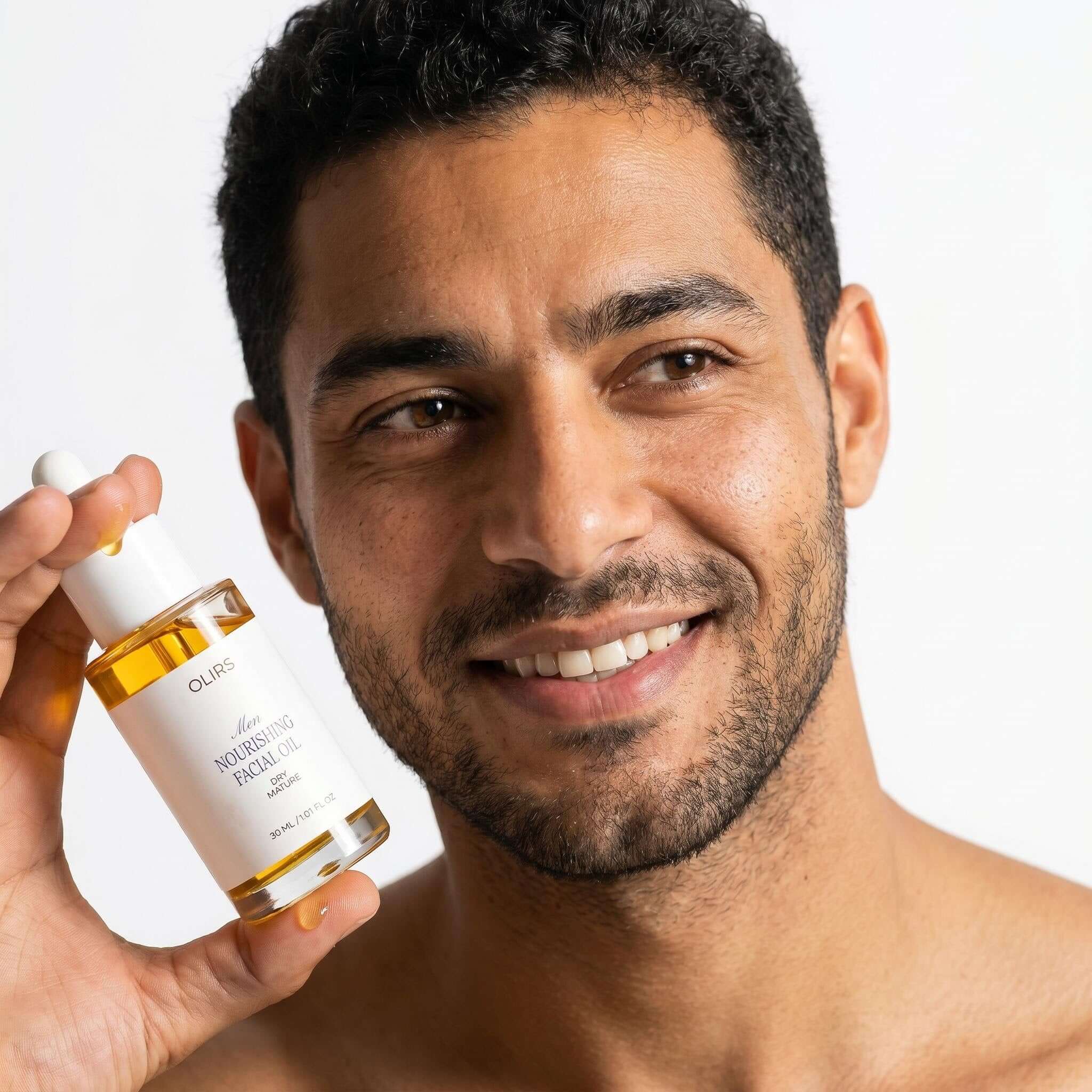 Man holding Nourishing Facial Oil, showcasing an organic skincare product for a healthy glow.