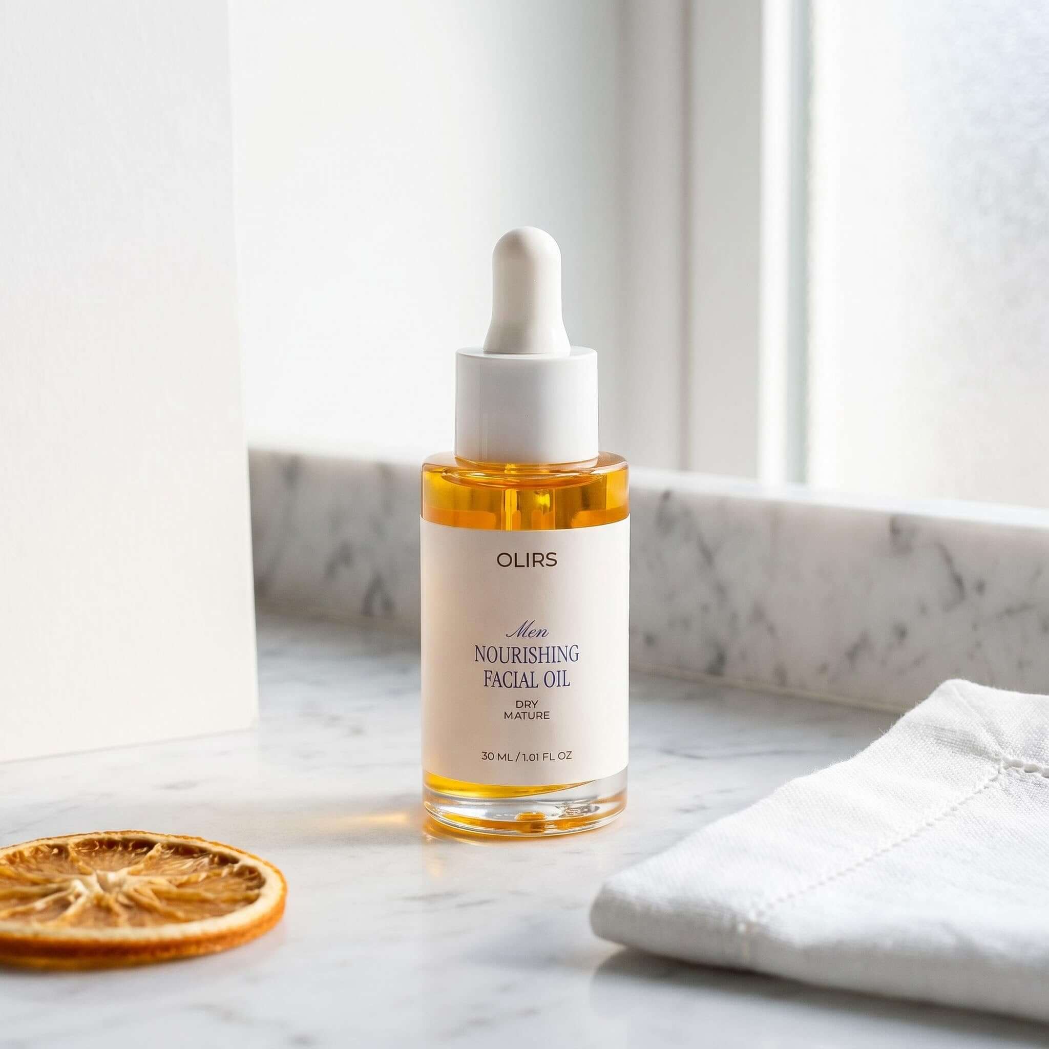 Nourishing Facial Oil in a glass bottle, featuring a dropper cap on a marble countertop.