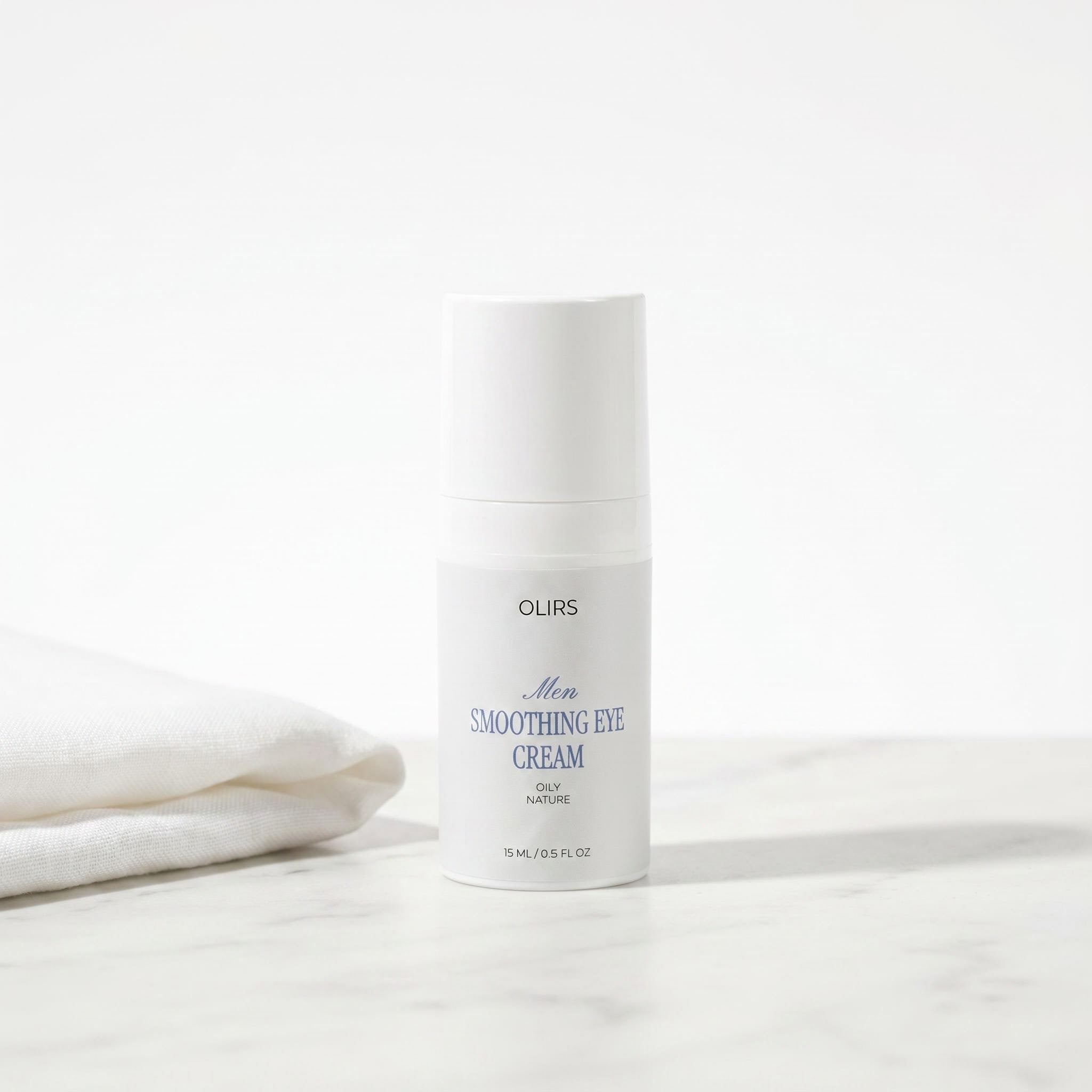 Men Smoothing Eye Cream bottle on marble surface with soft fabric beside it, ideal for revitalizing tired under-eyes.