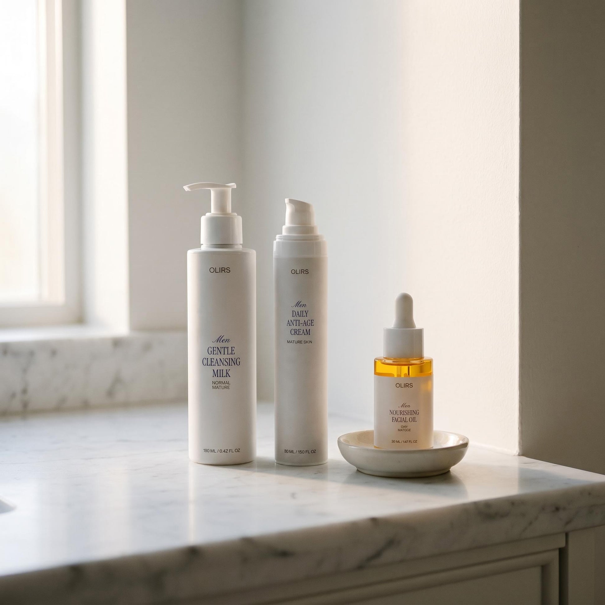 Glowy Skin Trio Collection Box featuring Gentle Cleansing Milk, Firm-Look Day Cream, and Nourishing Facial Oil.